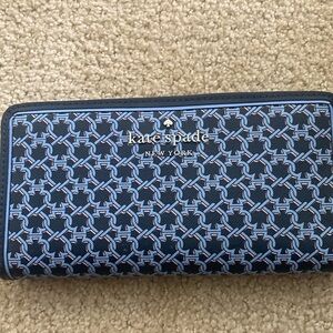 Brand new Kate Spade wallet- never been used and has tag/info inside it (see pic
